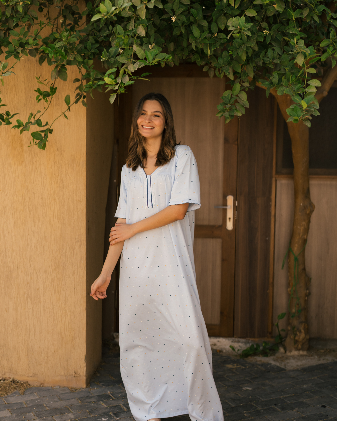 Women's long, half-sleeved shirt printed with heart buttons