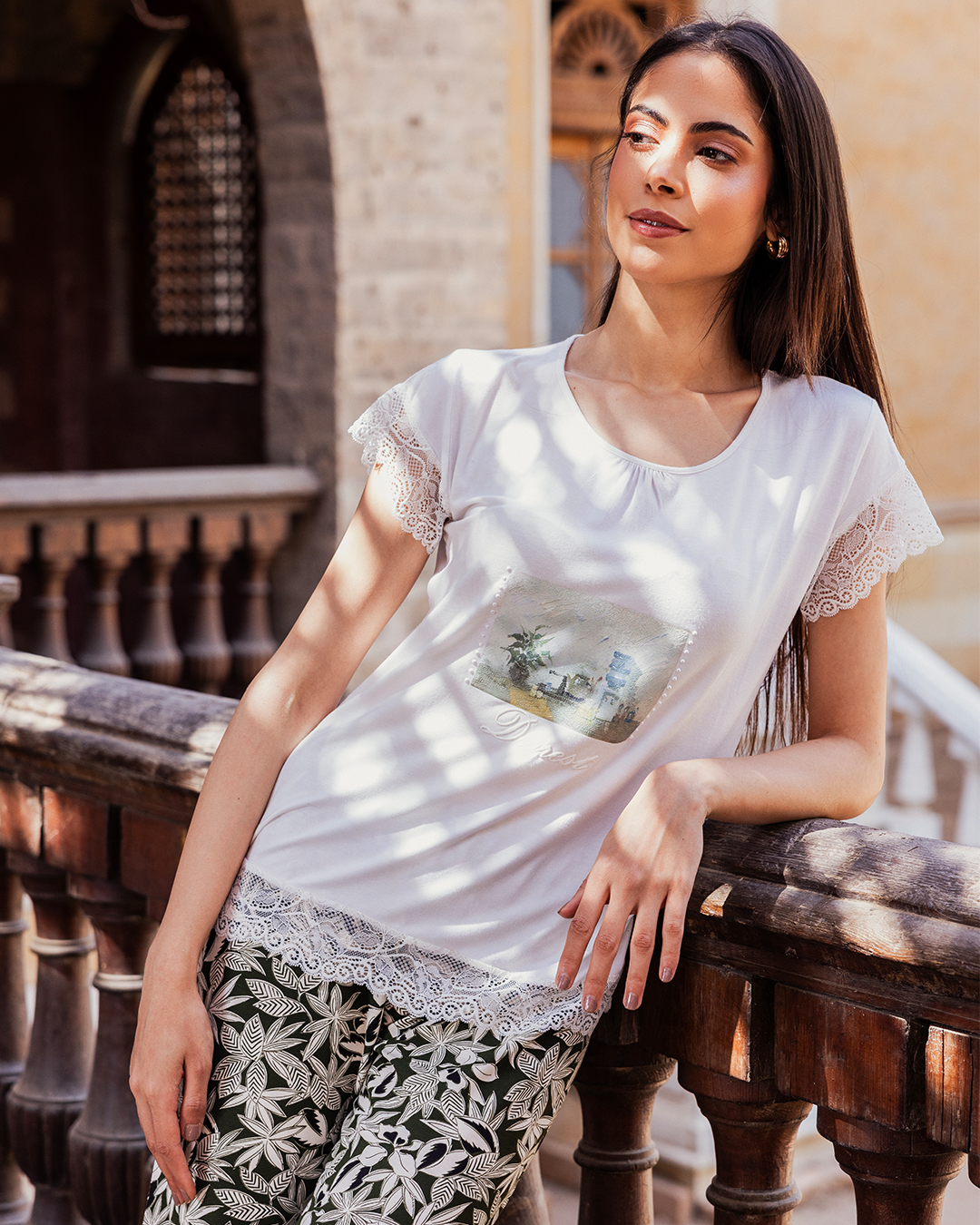 Women's pajamas with a half-sleeved top and a lace print and olive-rose trousers