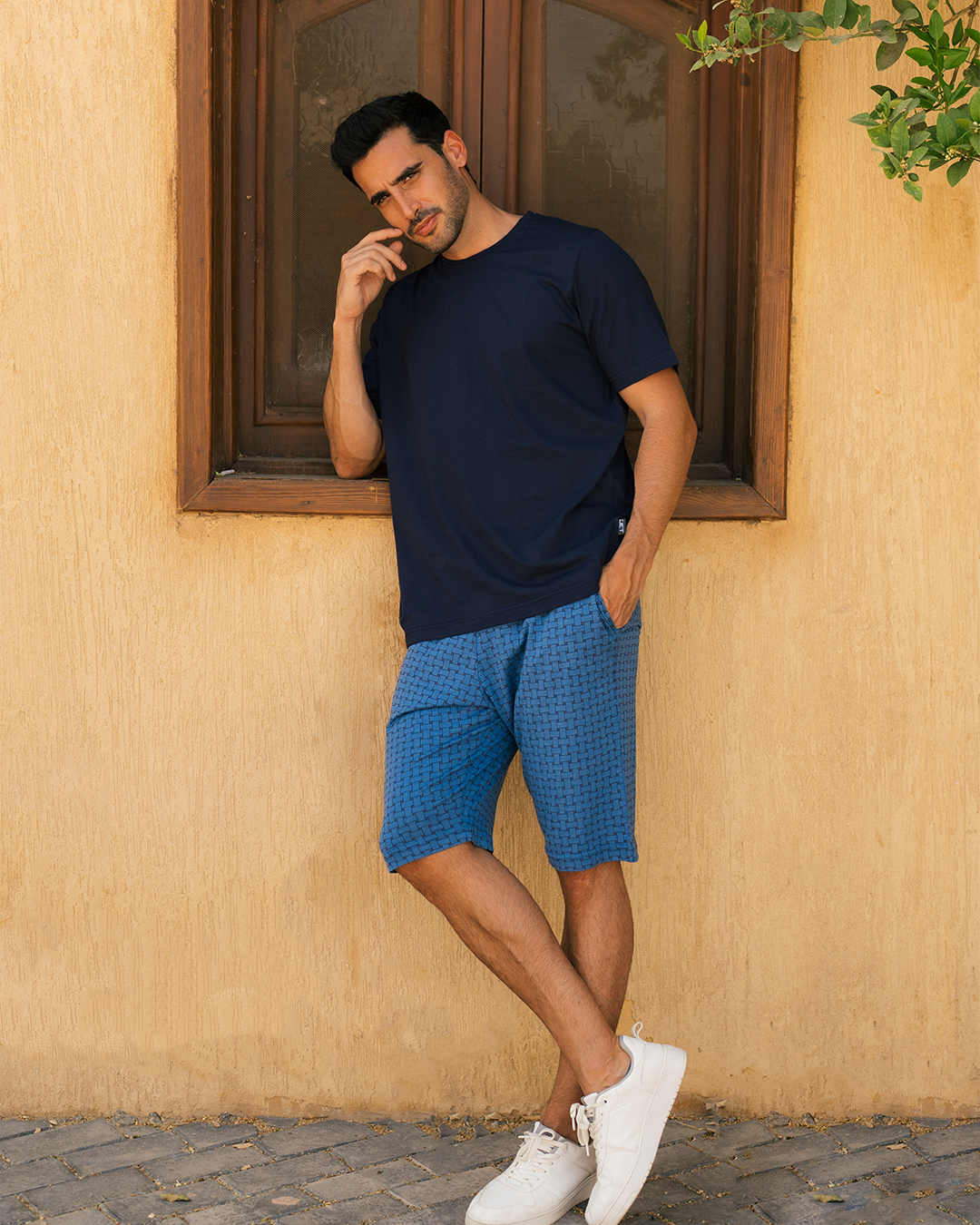 Plain men's pajamas with a half-sleeved T-shirt and shorts printed with rectangles