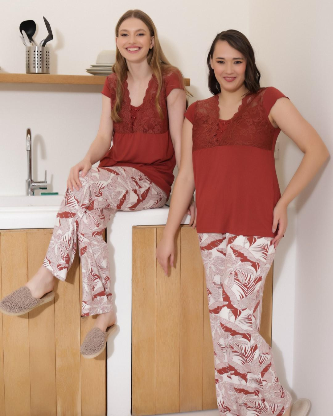 Women's pajamas with a quarter-sleeve t-shirt, lace on the chest, and floral trousers