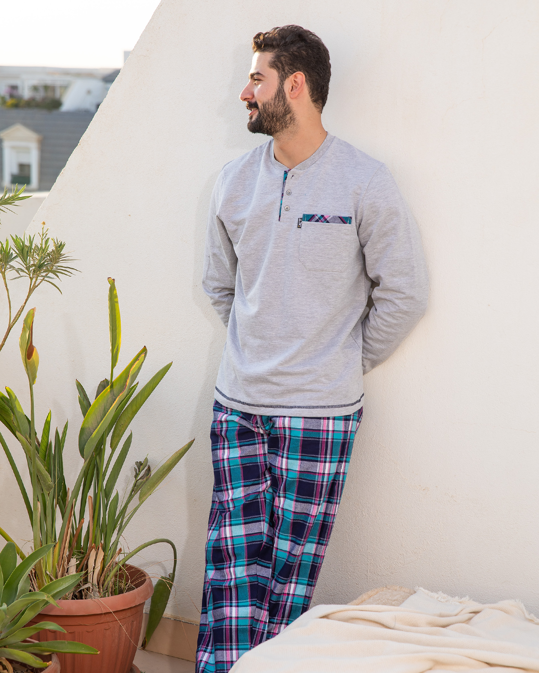 Men's pajamas with a button-up neck and checkered pants